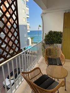 a balcony with chairs and a view of the ocean at Poseidon Breeze in Limassol