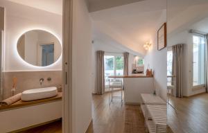 a bathroom with a sink and a mirror at Lemon Soul apartment Sorrento center in Sorrento +24 photos