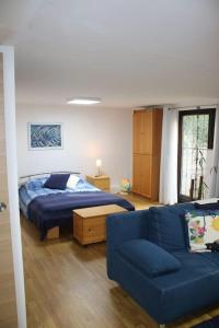 Postel nebo postele na pokoji v ubytování Souterain Appartement 19 min zu Fuß Downtown