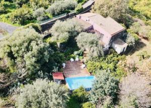 an aerial view of a house with a swimming pool at L'Aranceto in Acireale