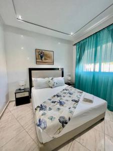 Una cama o camas en una habitación de Appart Hotel Rania