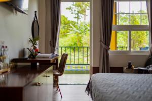 Letto o letti in una camera di Casanova Dalat Hotel