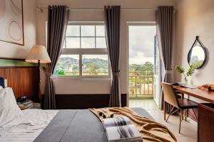 Letto o letti in una camera di Casanova Dalat Hotel