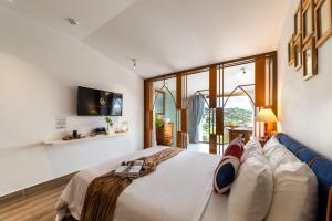 Letto o letti in una camera di Casanova Dalat Hotel