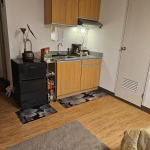 Kuchyň nebo kuchyňský kout v ubytování Mench Staycation