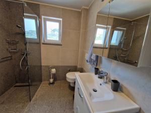 Koupelna v ubytování Modern Apartment Kompas