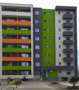 an apartment building with green and orange at cris residence in Alba Iulia