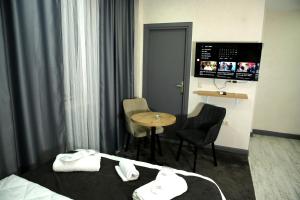 Postel nebo postele na pokoji v ubytování Minimalist Suit Otel
