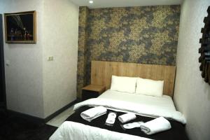 Postel nebo postele na pokoji v ubytování Minimalist Suit Otel