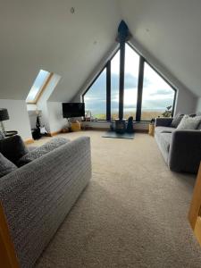 Sjónvarps- og/eða afþreyingartæki á Switha - Luxury home in Stromness, Orkney with outstanding views