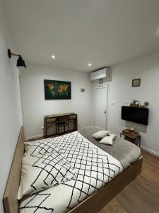 a bedroom with a large bed in a room at Chez Christian et Valérie in Rocbaron