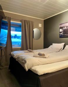 Postel nebo postele na pokoji v ubytování Stilren leilighet i Narvik!