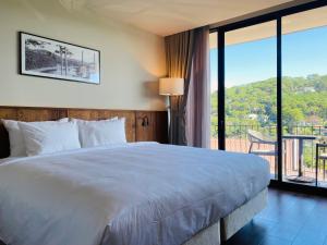 Voodi või voodid majutusasutuse HLS Dalat Lodge toas