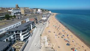 an aerial view of a beach with people on it at Aurora Spa Seaview Penthouse Ramsgate in Kent +37 photos