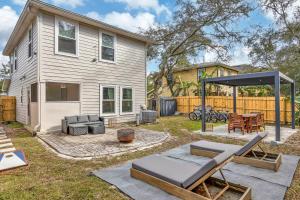 a backyard with a gazebo and a house at {Hidden Gem} Beach Home Blocks from Ocean +6 Bikes in Jacksonville Beach