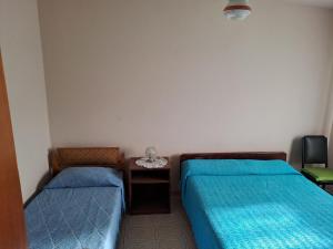 En eller flere senge i et værelse på Margarita