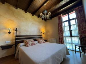 A bed or beds in a room at La Quintana de Villar