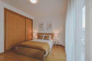 Ένα ή περισσότερα κρεβάτια σε δωμάτιο στο Relax Caparica Home