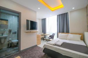 Postel nebo postele na pokoji v ubytování Minimalist Suit Otel