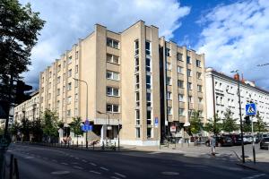 a large building on the side of a street at Studio Apartment in Kaunas