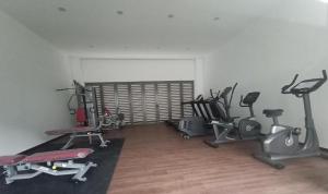 a gym with several exercise equipment in a room at Ammara Homestay 3 Palas horizon Kea Farm in Cameron Highlands