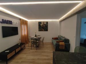 a living room with a couch and a table at Jaén Sky in Jaén