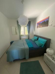 A bed or beds in a room at Villa NOVE - Residence dei Fiori