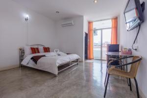 Llit o llits en una habitació de Tonwai Modern Place
