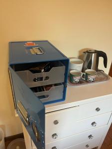 a blue box sitting on top of a dresser at FlyBGY in Orio al Serio