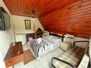 Cama ou camas em um quarto em Pousada Colibri Serrano