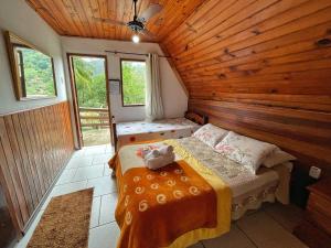 Cama ou camas em um quarto em Pousada Colibri Serrano