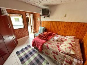Cama ou camas em um quarto em Pousada Colibri Serrano
