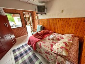 Cama ou camas em um quarto em Pousada Colibri Serrano