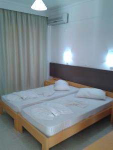 Postel nebo postele na pokoji v ubytování Fantasia Hotel Apartments