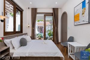 Postel nebo postele na pokoji v ubytování Sun Villa Resort Mini - Trệt Không Lầu - Full Giải Trí
