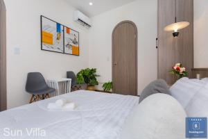 Postel nebo postele na pokoji v ubytování Sun Villa Resort Mini - Trệt Không Lầu - Full Giải Trí