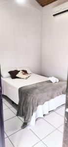 Cama ou camas em um quarto em Pousada Pitaya Maresias