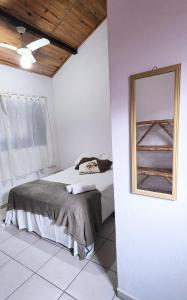 Cama ou camas em um quarto em Pousada Pitaya Maresias