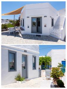 a white house with black doors and a patio at Dora's traditional houses in Apollonia
