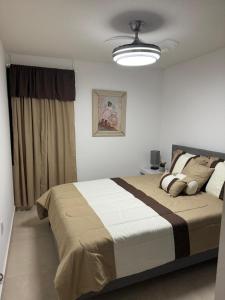 a bedroom with a large bed and a ceiling at Jardines in San Miguel de Allende