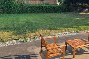 two wooden benches and a table in a yard at Perfect Lehigh Valley Oasis in Bethlehem