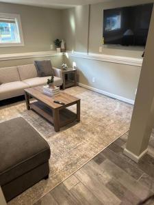 a living room with a couch and a coffee table at Perfect Lehigh Valley Oasis in Bethlehem