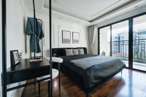 Ένα ή περισσότερα κρεβάτια σε δωμάτιο στο Soleil Residence WestLake Hanoi