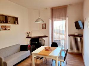 a living room with a couch and a table at Il balcone sulla Marsica in Celano