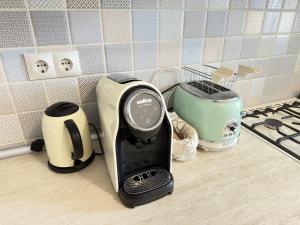 a hair dryer sitting on a counter in a kitchen at Diamond home Apartments in Chişinău