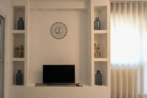 TV a/nebo společenská místnost v ubytování Angel Home