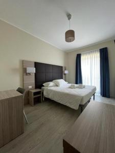 Postel nebo postele na pokoji v ubytování Adalesia Hotel & Coffee