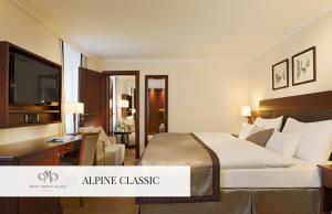 A bed or beds in a room at Mont Cervin Palace
