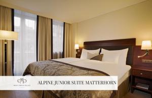 A bed or beds in a room at Mont Cervin Palace