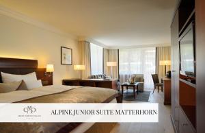 A bed or beds in a room at Mont Cervin Palace